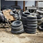 Old used car tires at a junkyard. Rubber tire recycling.